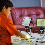 MOSI student playing with robots