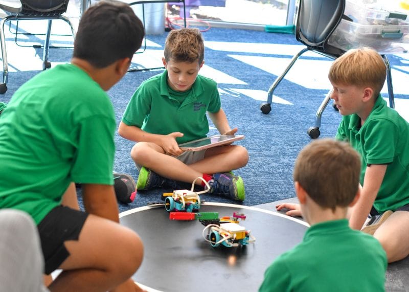 Corbett Prep Students playing and working on robots