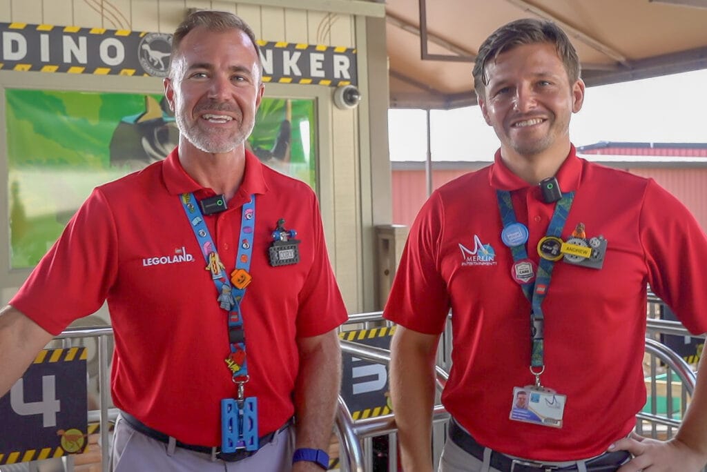 Cory Lytle and Andrew Walker in front of Coastersaurus at LEGOLAND Florida Resort.