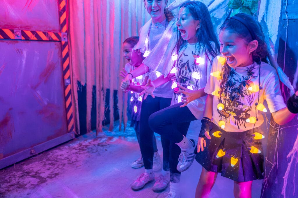 ZooTampa Creatures of the Night 2026 Kids at Scared of the Dark kids walking through haunted trail