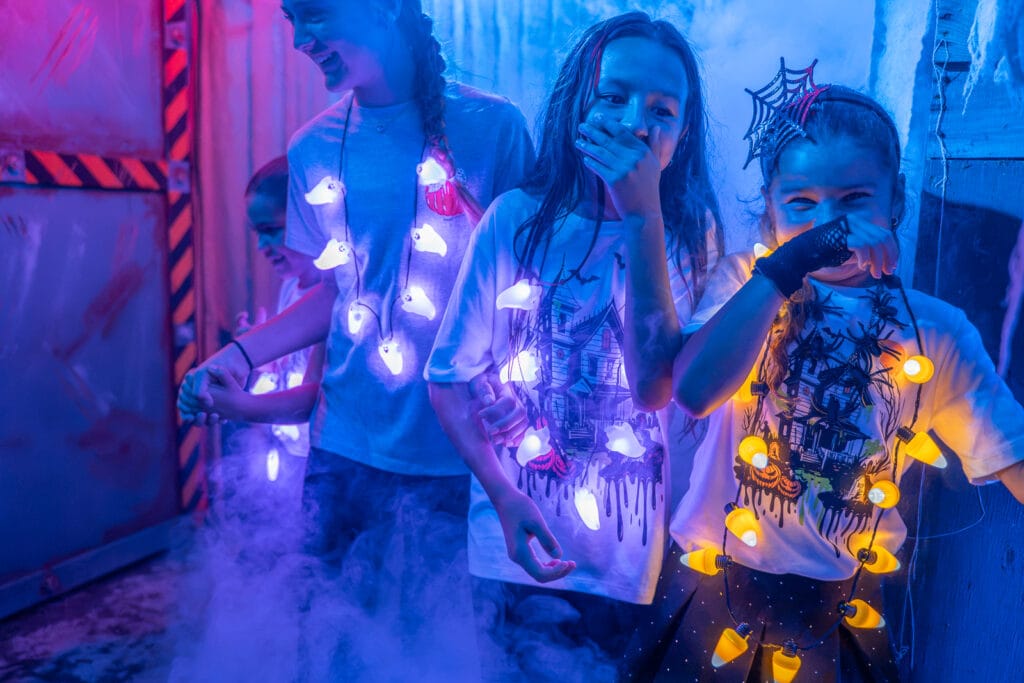 ZooTampa Creatures of the Night Kids at Scared of the Dark kids walking through haunted trail