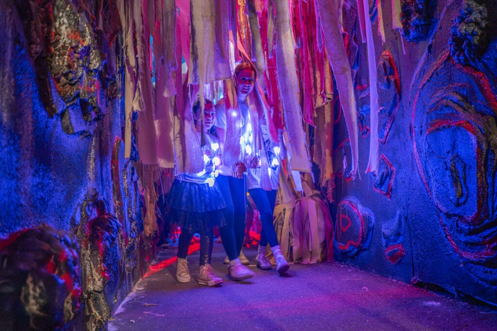 ZooTampa Creatures of the Night Kids at Scared of the Dark Kids walking under spide webs