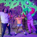 ZooTampa Creatures of the Night 2026 Troll Cave family posing with troll