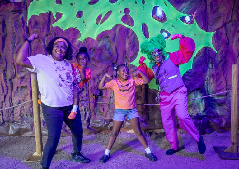 ZooTampa Creatures of the Night 2026 Troll Cave family posing with troll
